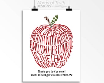 May include: Red apple-shaped graphic with the text "Proverbs 3:12" and "She opens her mouth with wisdom and on her tongue is the law of kindness" inside. The text "Thank you to the core! HPCS Kindergarten Class 2021-22" is below the apple.