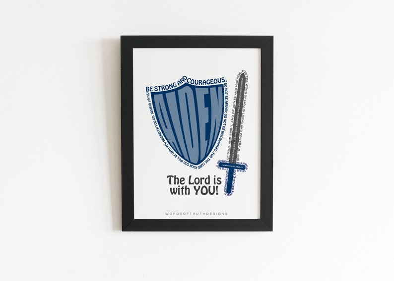 May include: A framed print with a blue shield and sword design. The shield is made up of the word "Aiden" and the sword is made up of a Bible verse. The text below reads "Be strong and courageous. The Lord is with you!" and "WORDSOFTRUTHDESIGNS".
