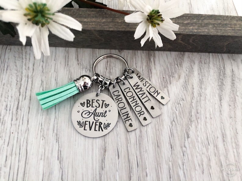 a Handmade Stainless Steel with phrase "BEST AUNT EVER" and personalized kid's name key chain with Faux Leather Tassel is the best gift for your aunt