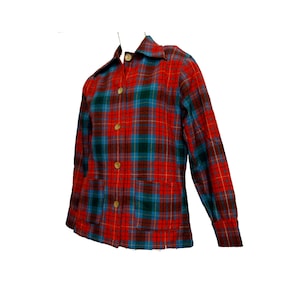 May include: A red, blue, and green plaid button-up shirt with long sleeves and two front pockets.