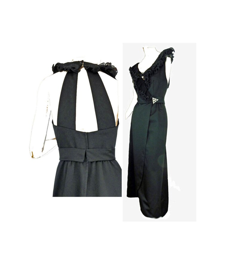 May include: A black halter dress with a ruffled neckline and a keyhole back. The dress has a fitted bodice and a flowing skirt.