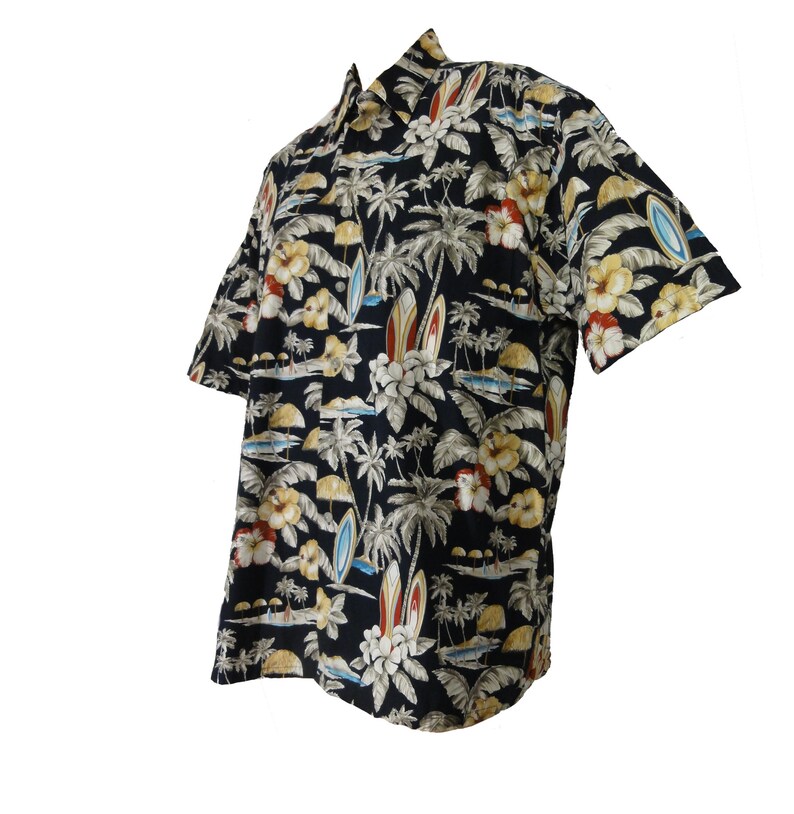 May include: A black short-sleeved shirt with a tropical print featuring palm trees, flowers, and surfboards.