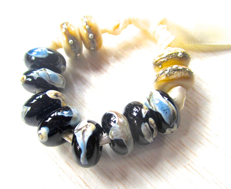 Shards on Black and Silvered Ivory Handmade Lampwork Bead Set