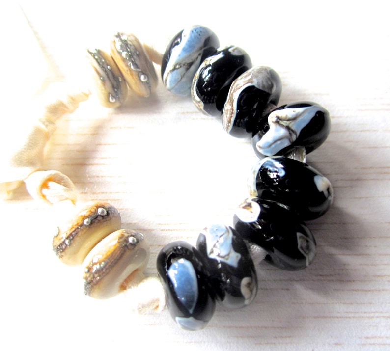 Shards on Black and Silvered Ivory Handmade Lampwork Bead Set