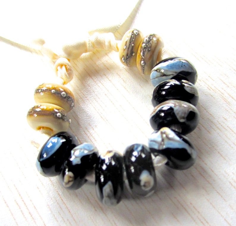 Shards on Black and Silvered Ivory Handmade Lampwork Bead Set