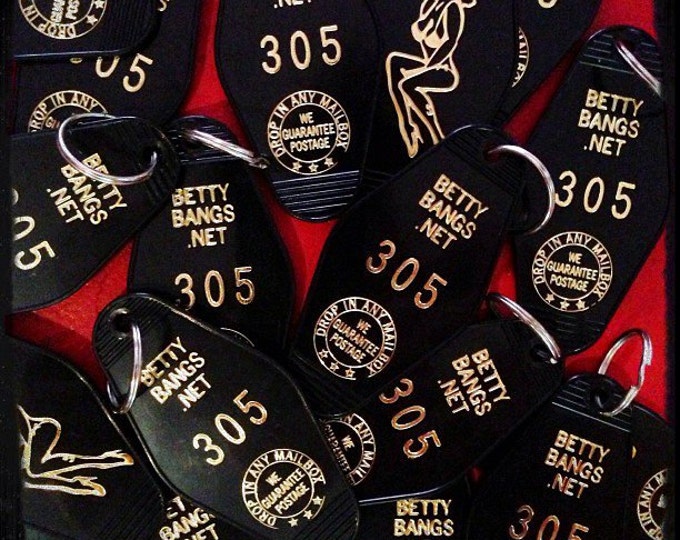 Antique car key chain with bell and eye in red or yellow