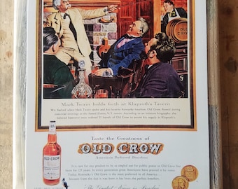 May include: Vintage advertisement for Old Crow bourbon featuring a painting of Mark Twain with a group of men in a tavern. The text reads "Taste the Greatness of Old Crow, America's Preferred Bourbon." and "The Greatest Name in Bourbon."