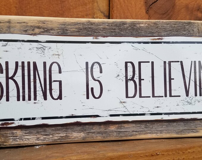 Recycled wood framed street sign-Skiing is believing
