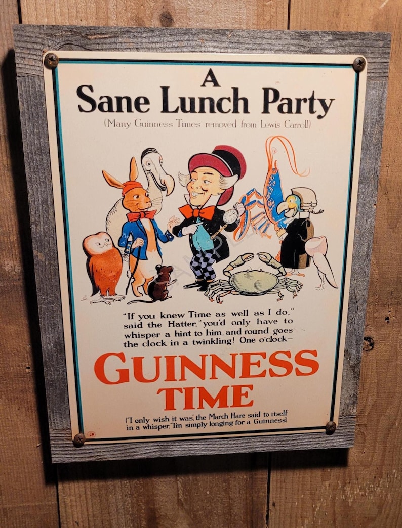 May include: A framed vintage-style sign with a whimsical illustration. The sign reads "A Sane Lunch Party" and "Guinness Time" with characters from Alice in Wonderland. The frame is made of weathered wood.
