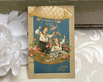 Beautiful Antique Birthday Postcard Boy & Girl in Gold Hot Air Balloon Zeppelin Surrounded by Flowers c 1910 Vintage Post Card