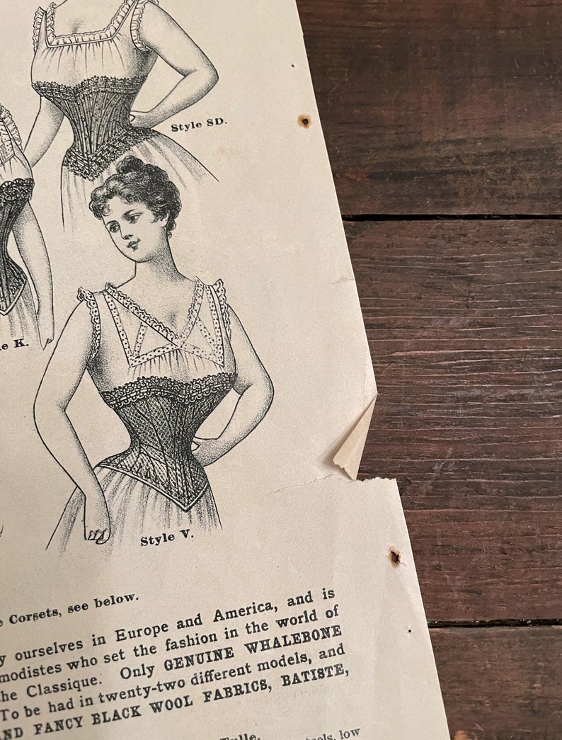 May include: A vintage advertisement for corsets featuring two women wearing different styles. The text reads "Corsets, see below.  Only GENUINE WHALEBONE to be had in twenty-two different models, and FANCY BLACK WOOL FABRICS, BATISTE, Style SD. Style V."