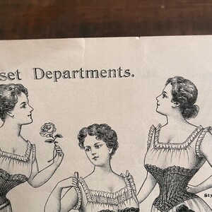 May include: Black and white illustration of three women wearing corsets. The text "Corset Departments" is at the top of the image.