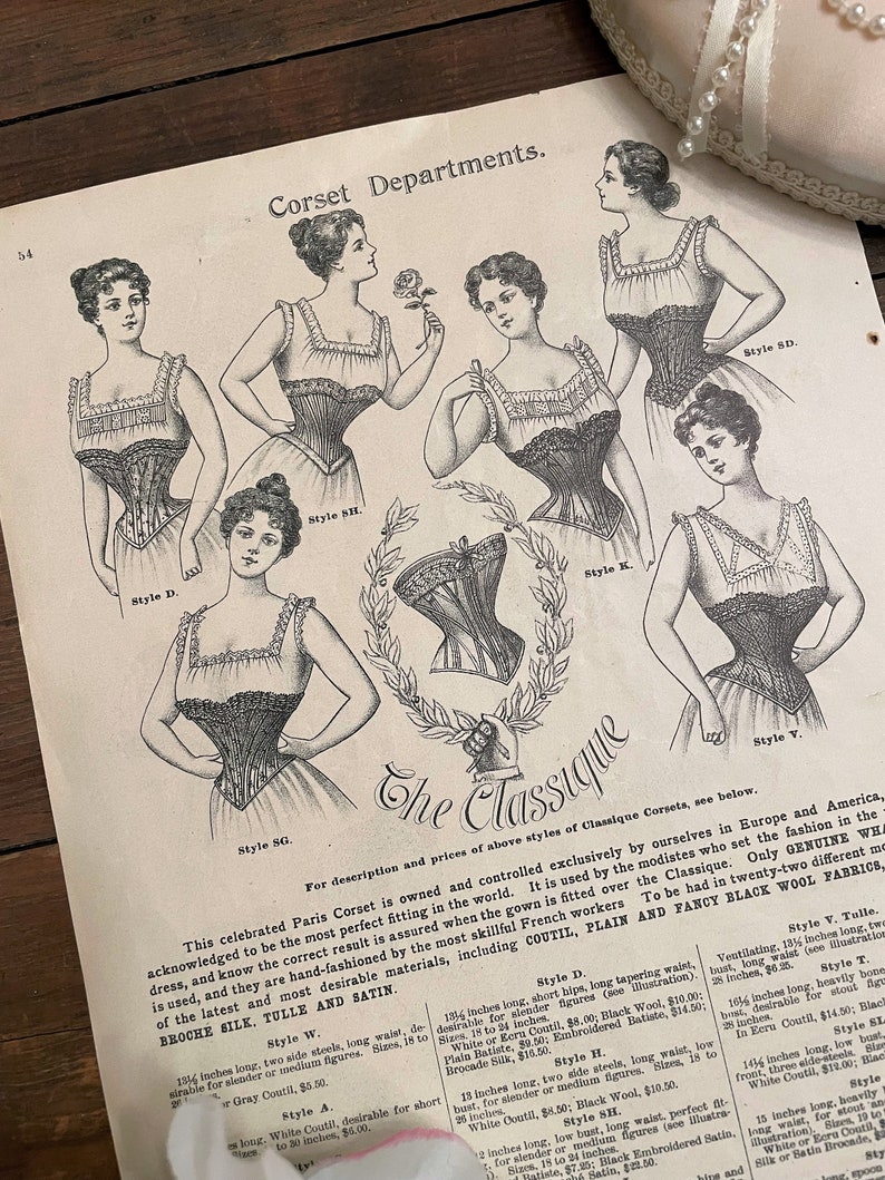 May include: A vintage advertisement for The Classique Paris Corset, featuring seven different styles of corsets worn by women. The ad highlights the corset's perfect fit and craftsmanship, mentioning the use of high-quality materials like coutil, plain and fancy black wool fabrics, broche silk, tulle, and satin.