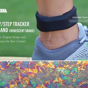 May include: A black ankle band with the text "Choose Your Fabric!"  The band is worn on a person's ankle with a gray and green running shoe. The band is made of a stretchy material and has a iridescent snake pattern.