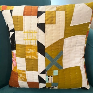 X Marks The Spot hand-quilted pillow. Abstract. Geometric. Gold and White with pops of color. Perfect for any decor. 16x 16 image 1