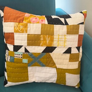 X Marks The Spot hand-quilted pillow. Abstract. Geometric. Gold and White with pops of color. Perfect for any decor. 16x 16 image 4