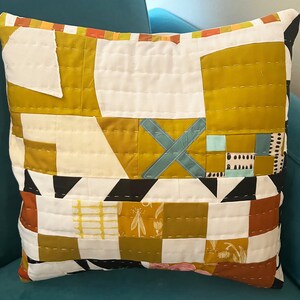 X Marks The Spot hand-quilted pillow. Abstract. Geometric. Gold and White with pops of color. Perfect for any decor. 16x 16 image 2