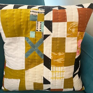 X Marks The Spot hand-quilted pillow. Abstract. Geometric. Gold and White with pops of color. Perfect for any decor. 16x 16 image 3