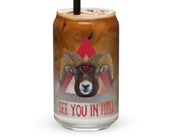 May include: A clear glass can-shaped cup filled with a layered drink, featuring a black straw. The cup is decorated with a ram's head graphic with a red eye, set within a red triangle and the text "SEE YOU IN HELL".