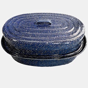 May include: A blue enamel oval roaster with a lid. The roaster has a speckled white pattern and a black rim. The lid has a small handle. This cookware is suitable for roasting meats and vegetables.