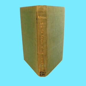 May include: A green hardcover book with the title "In the Hands of the Seneschal" by Edmond Fic Edm.