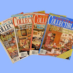 May include: Four copies of American Country Collectibles magazine. The covers feature a variety of home decor themes, including 100s of affordable decorating ideas, 1001 new ideas for decorating, and creative decorating for collectors.