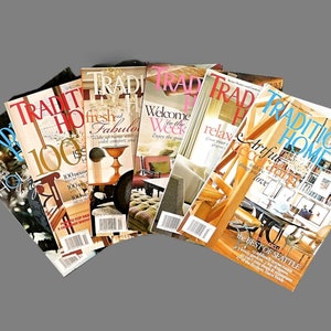 May include: A stack of six Traditional Home magazines with different covers featuring interior design themes. The covers include "fresh and fabulous", "Welcome to the Week", "relax", "Artful Living", and "The Best of Seattle".