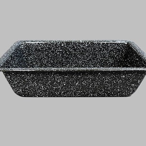 May include: A rectangular baking dish with a speckled black and white pattern. The dish has a slightly flared shape and is made of a durable material. Ideal for baking casseroles, roasting vegetables, or other culinary creations.