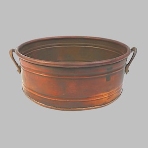 May include: A set of three ceramic mugs with a speckled, matte finish. The mugs are in shades of cream, light brown, and dark brown. Each mug has a simple, minimalist design and a rounded handle. The mugs are stacked on top of each other.