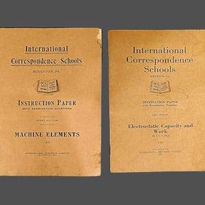 May include: Two brown paperbacks with the title "International Correspondence Schools" and the text "Instruction Paper" on the front covers. The left book is titled "Machine Elements" and the right book is titled "Electrostatic Capacity and Work".