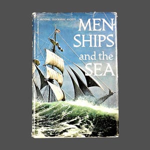May include: Vintage book cover titled "MEN SHIPS and the SEA" by the National Geographic Society. The cover features a painting of a tall ship sailing through rough, green ocean waves under a blue sky. The book's title is in large white letters.