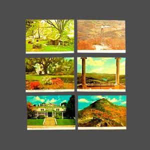 May include: A collection of six vintage postcards featuring scenic views. The postcards depict landscapes with buildings, trees, and mountains. The color palette includes greens, blues, and browns, with some cards showing text at the bottom.