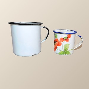 Two Vintage Enamelware Cups - One White with Black Trim - One White with Blue Trim and Handpainted and Signed by Artist