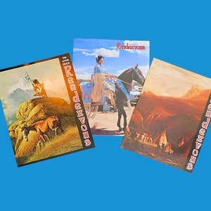 May include: Three vintage paperback books with a western theme. The covers feature illustrations of Native Americans on horseback, a mountain range, and a group of people gathered around a campfire. The books are titled "The Wind River Rendezvous".