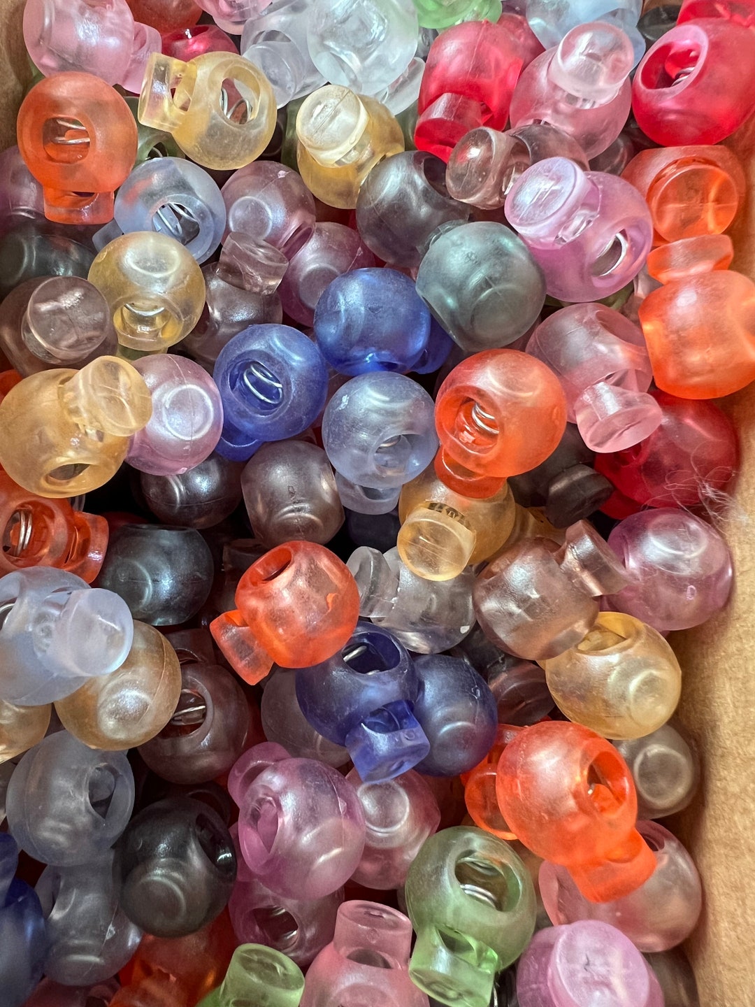 Small Cord Locks Translucent Jelly Style Single Hole Barrel Round 3mm by 6mm Hole Spring Loaded