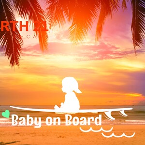 May include: White silhouette of a baby sitting on a surfboard with the text "Baby on Board" and a green heart. The background is a sunset over a beach with palm trees.