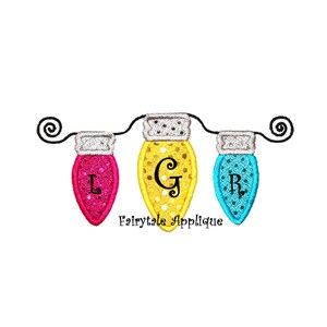 May include: Three colorful light bulbs with the letters L, G, and R on them, strung together with a black wire. The bulbs are pink, yellow, and blue.