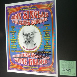 May include: A concert poster for John Sinclair and His Blues Scholars, featuring a photo of John Sinclair and the text "Big Chili Productions Presents". The poster advertises two shows, one on Friday, September 8, 2000 at the Powerhouse Brewery in Sebastopol, California, and the other on Saturday, September 9, 2000 at the Paradise Lounge in San Francisco, California. The poster also features the text "And Featuring Special Guest Wayne Kramer" and "The White Buffalo Prayer Tour".