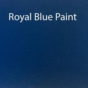 May include: A solid, deep blue paint sample. The text "Royal Blue Paint" is written in white on the surface.