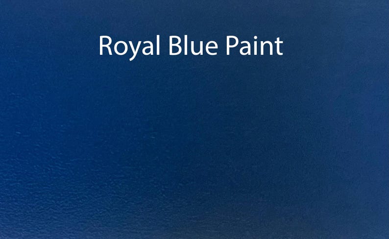 May include: A solid, deep blue paint sample. The text "Royal Blue Paint" is written in white on the surface.