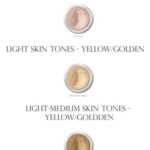 May include: Three small jars of foundation makeup in different shades. The shades are labeled "New! Clay", "New! Honey Beige", and "New! Golden Beige".