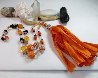 Long Beaded Chain Necklace in Orange and Black, Adorned with Playful Beads, Gemstones, Sari Silk Ribbon Tassel - Mesmerizing Fall Symphony