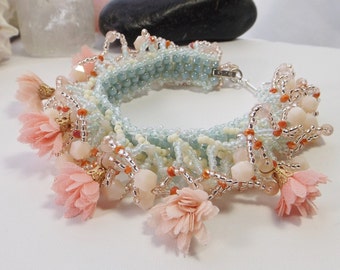 Exquisite Hand-Woven Statement Cuff Bracelet: A Blend of Coral, Blue, and Pink, with Flower Tassels, Glass and Seed Beads - Gift for Her