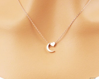 I love you to the moon and back necklace. Tiny rose gold moon and heart necklace. Elegant and dainty necklace