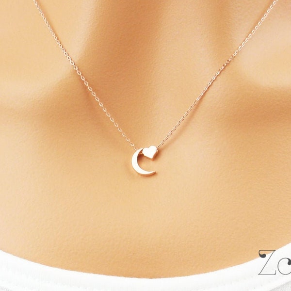 I love you to the moon and back necklace. Tiny rose gold moon and heart necklace. Elegant and dainty necklace