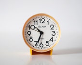 Vintage yellow mechanical alarm clock SLAVA