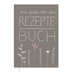 Peut inclure: Un livre de recettes gris avec le texte "Mein großes Alles-Drin-Rezepte Buch" et un petit cœur rose. Le livre est décoré d'illustrations florales blanches et roses.