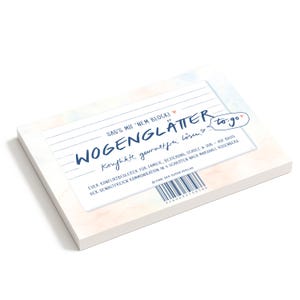 Op de afbeelding: Een notitieblok met de tekst "WOGENGLÄTTER to go" in blauw schrift. Het notitieblok heeft een witte rand en een achtergrond in aquarel-stijl met roze en blauwe tinten. De tekst beschrijft een gids voor conflictresolutie.
