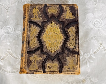 Biblia antigua de 1874 con espejo, encuadernación victoriana dorada, alegoría religiosa ilustrada, Bradley Garretson.