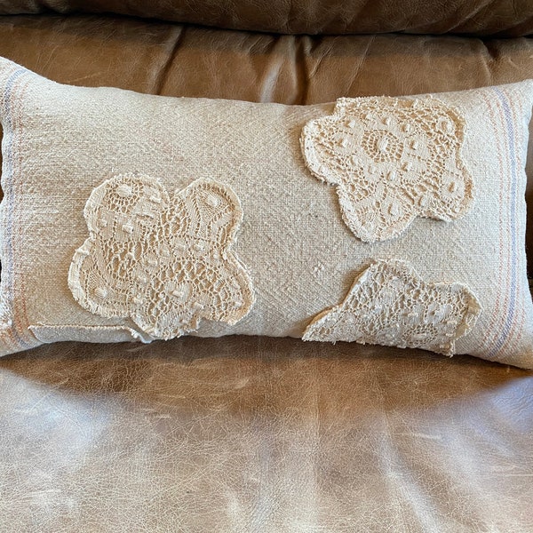 ANTIQUE LACE FLOWERS On a vintage Grainsack pillow